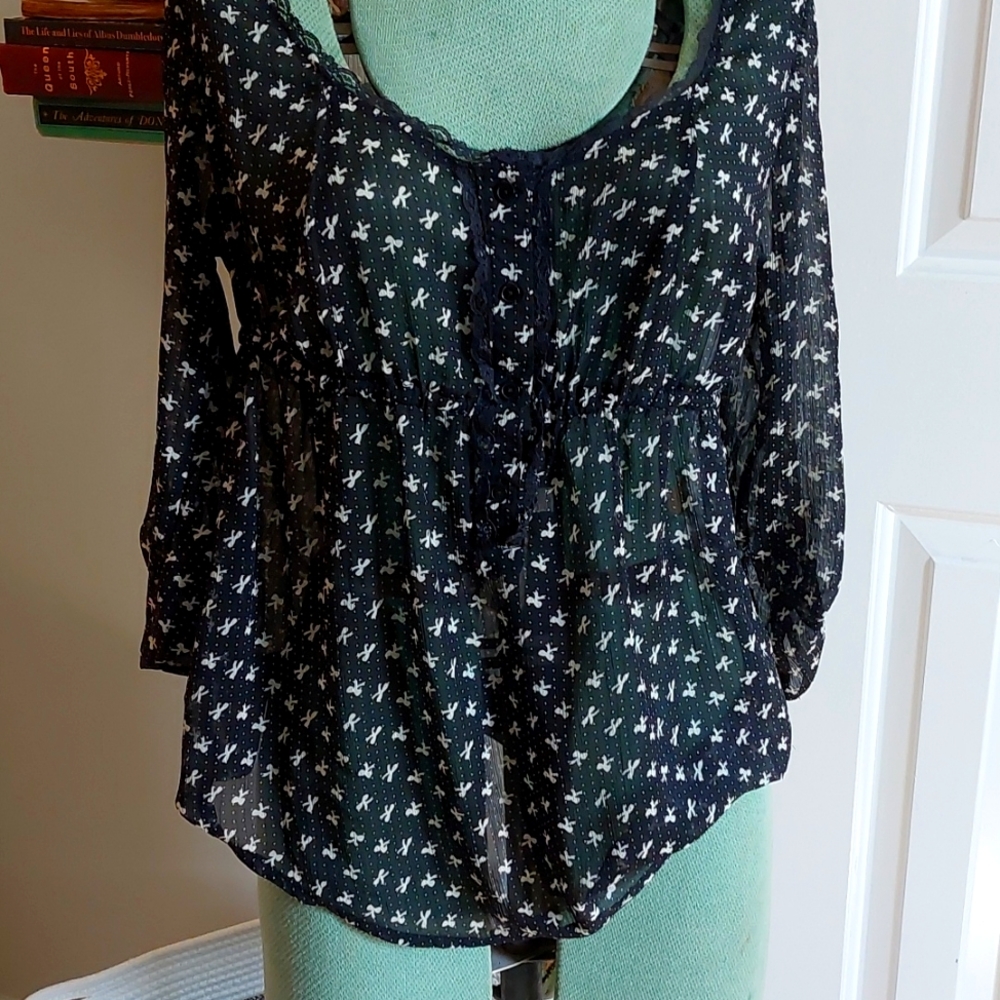 Kirra sheer black top with white bows